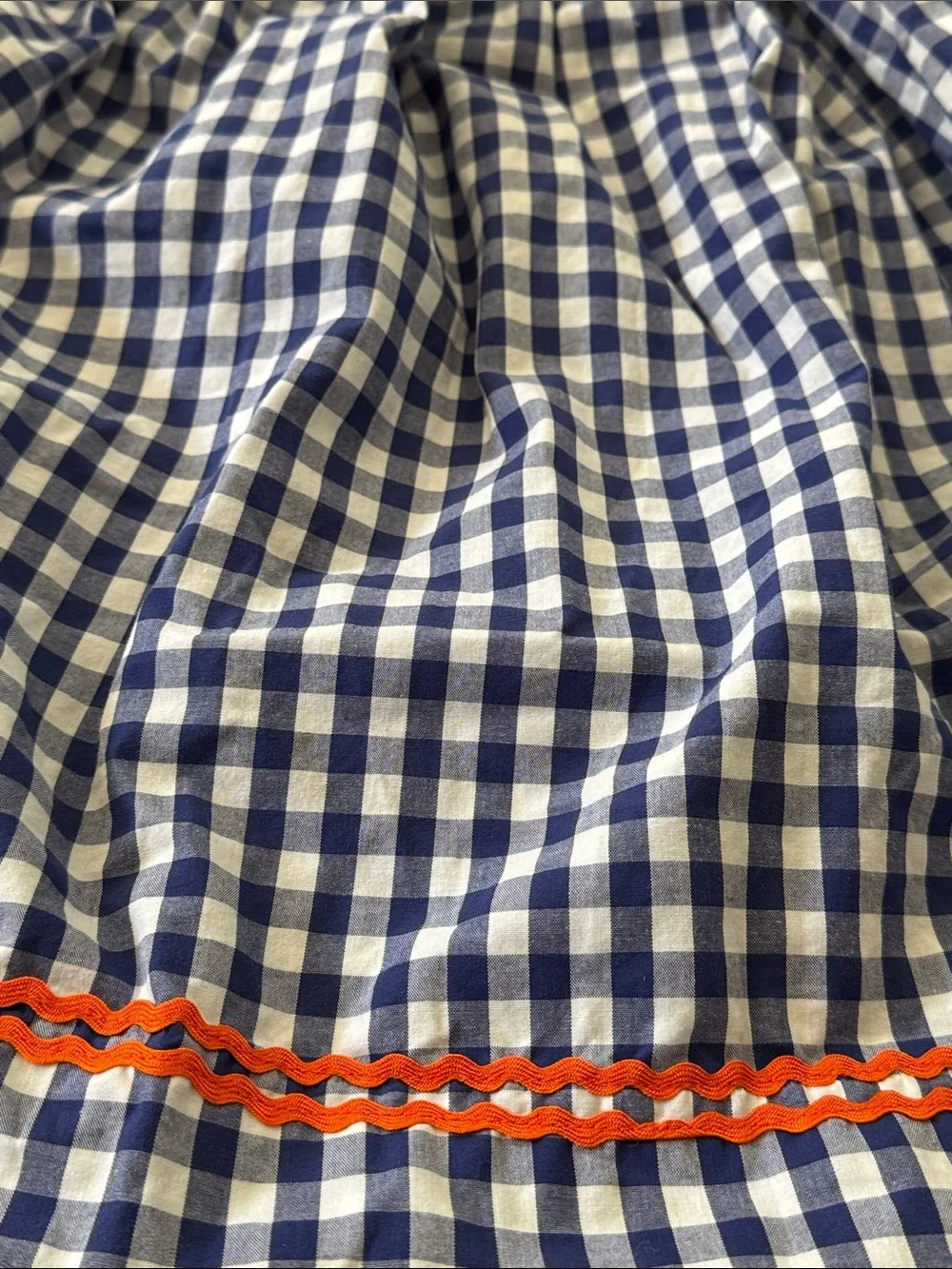 Cecil And Lou Navy Gingham Smocked Dress with Smocked Orange Pumpkin Embroidery